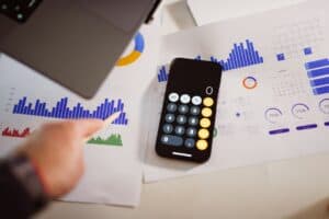 Calculator and laptop for planning a small business SEO and Google Ads budget