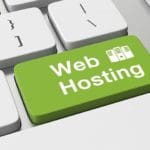 keyboard with green enter key text web hosting